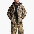 Person wearing a camouflage jacket and pants on a white background